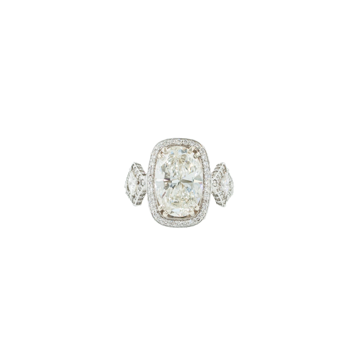 Diamond ring with a large central gemstone and smaller stones on a white background