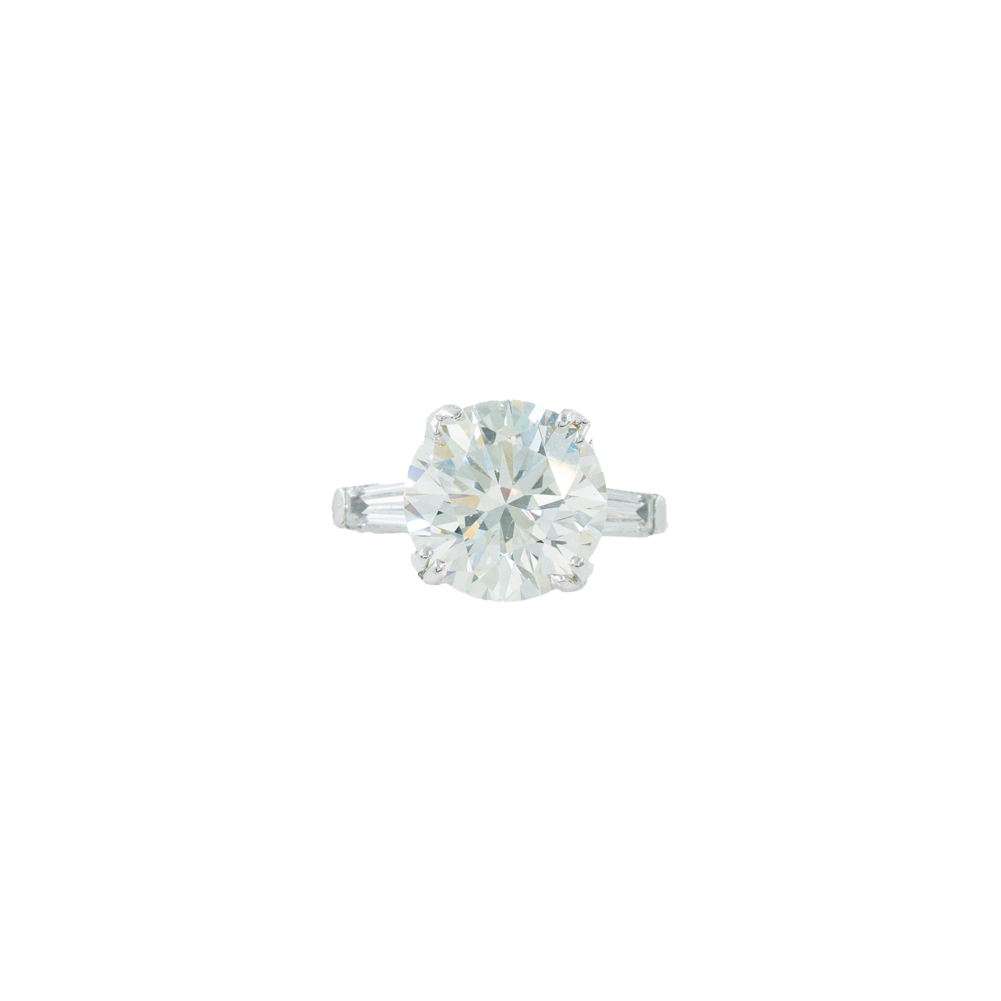 Solitaire diamond ring on a white background