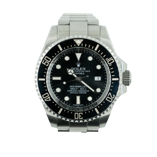 Rolex watch with black dial and silver metal bracelet on a white background