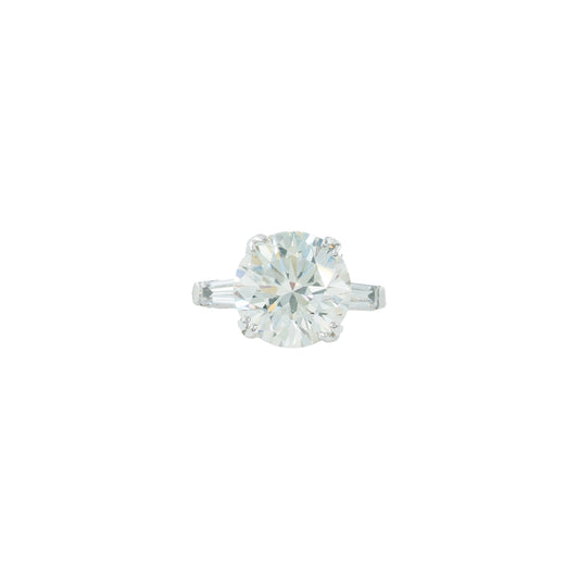 Solitaire diamond ring on a white background